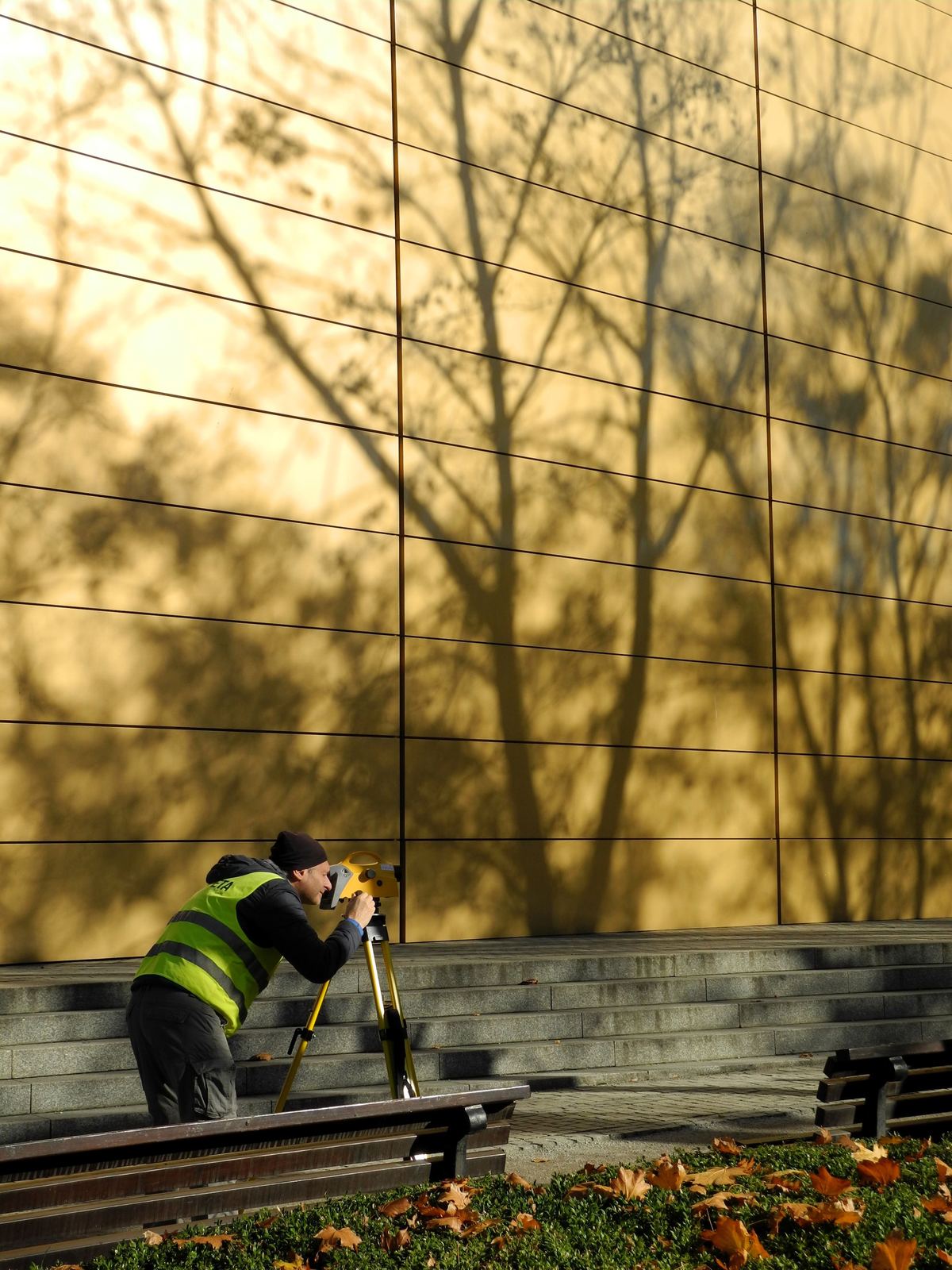 Surveyor in protective suit conducting asbestos survey