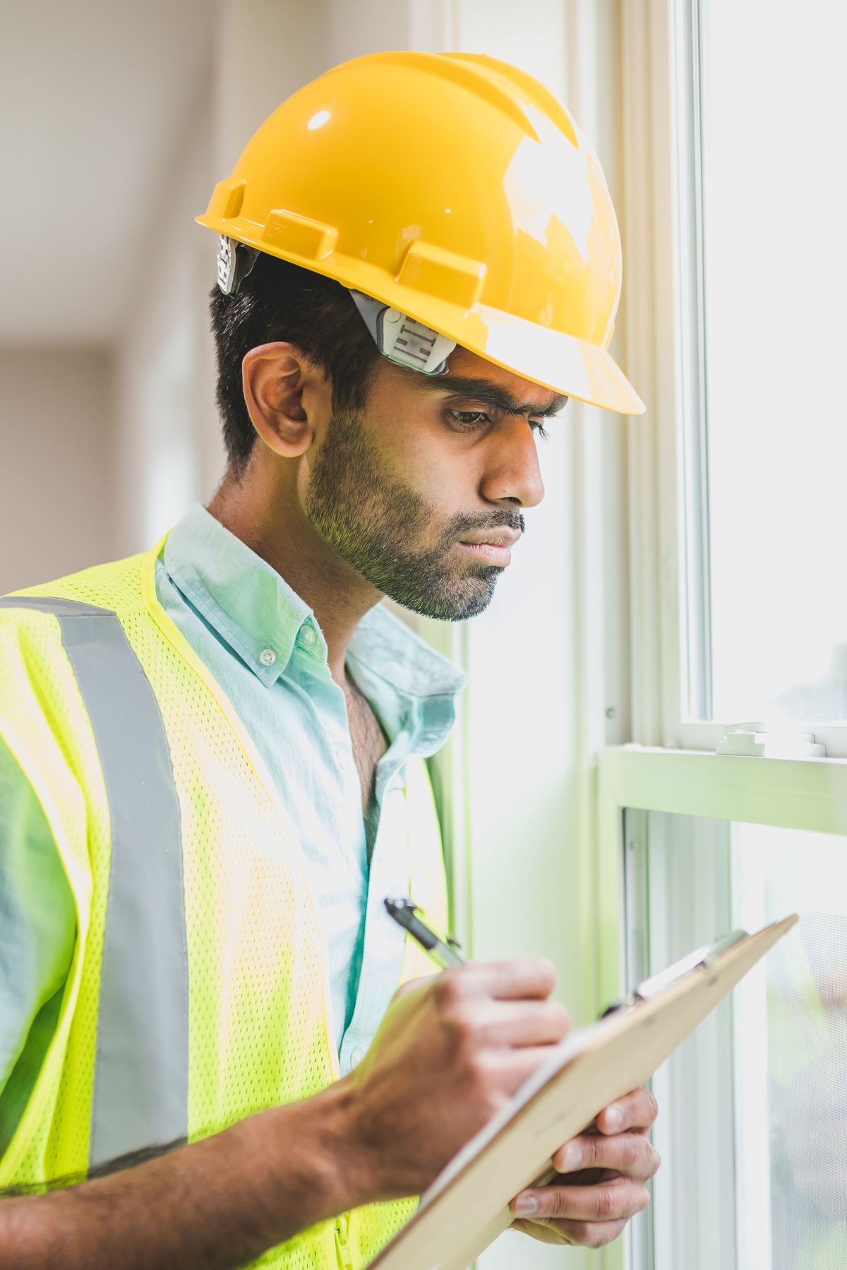 Property compliance engineer carrying out an inspection