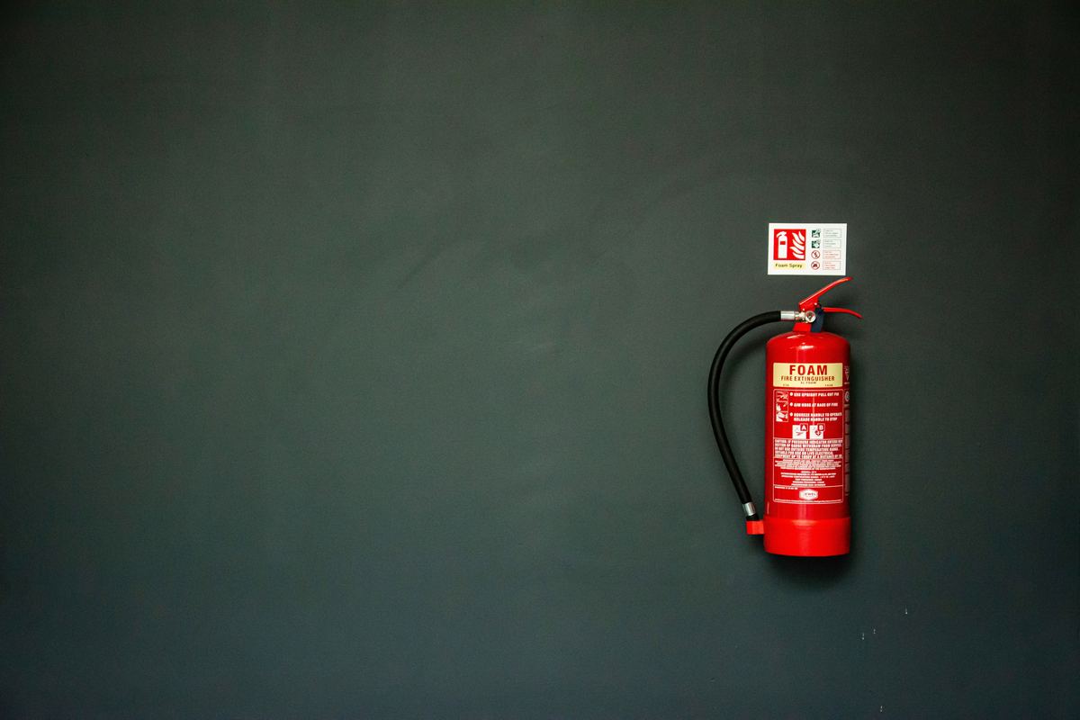 Fire extinguisher mounted on wall ready for inspection