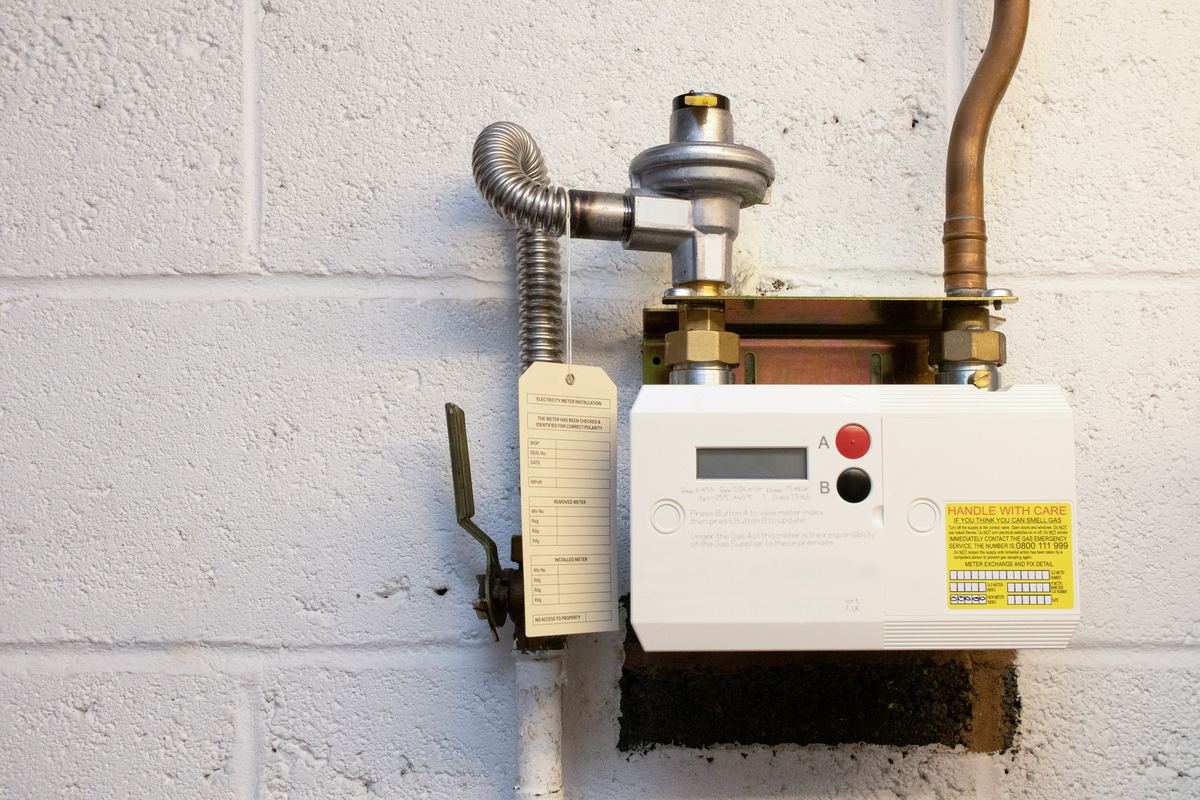 Gas Safe engineer inspecting boiler